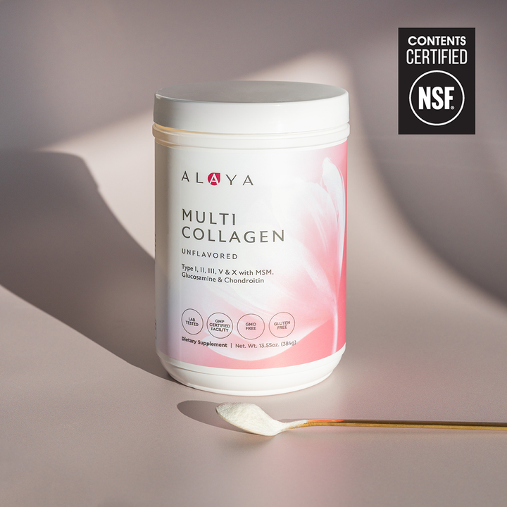 Alaya Multi Collagen Unflavored Powder supplement bottle on a dusty pink background with a gold spoon and powder  #flavor_unflavored #size_large